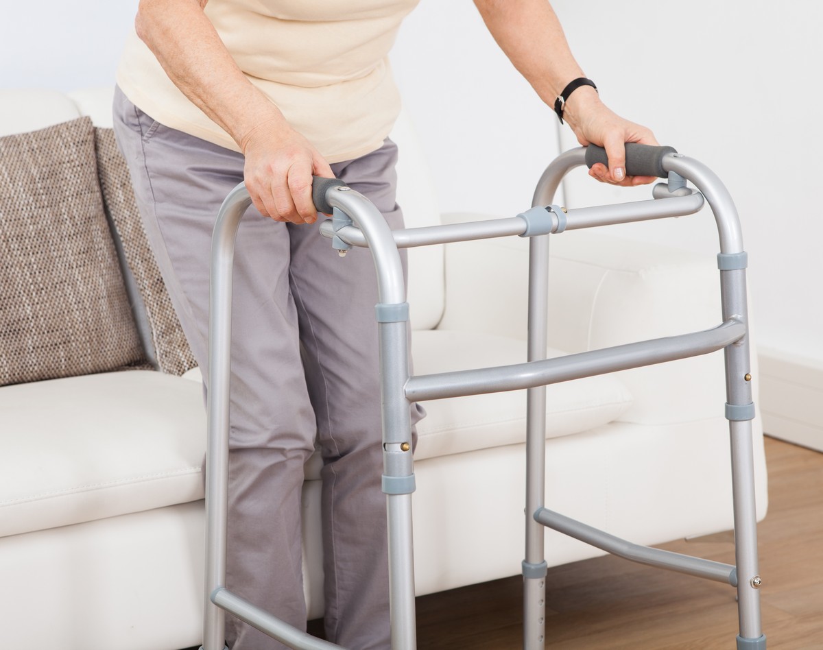 Senior Woman Using Walking Frame