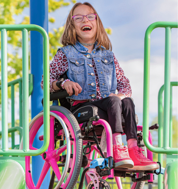 Image of child using the Little Wave Clip wheelchair on a playground